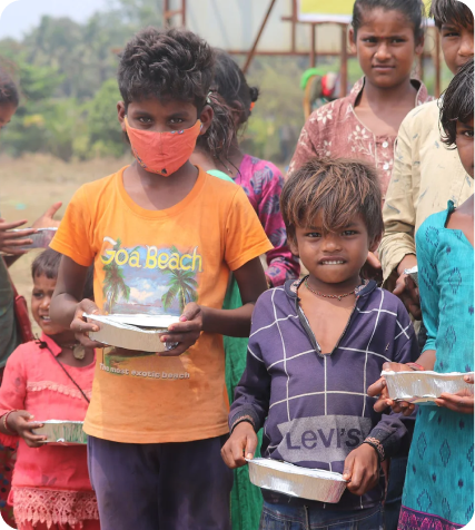 Children receiving a meal through El Shaddai Charitable Trust